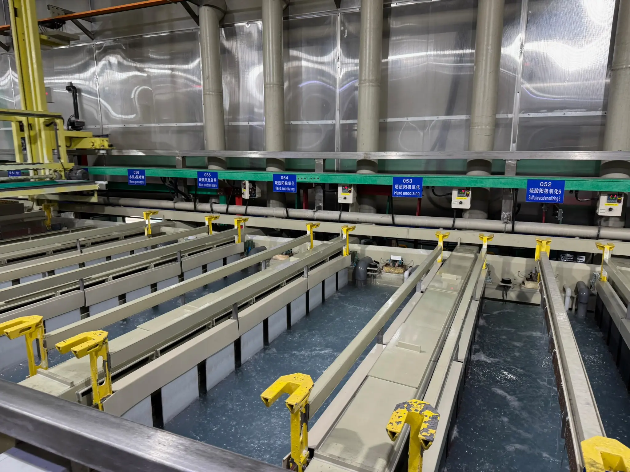 Production anodising line — sulphuric acid and hard anodising baths with overhead transfer system