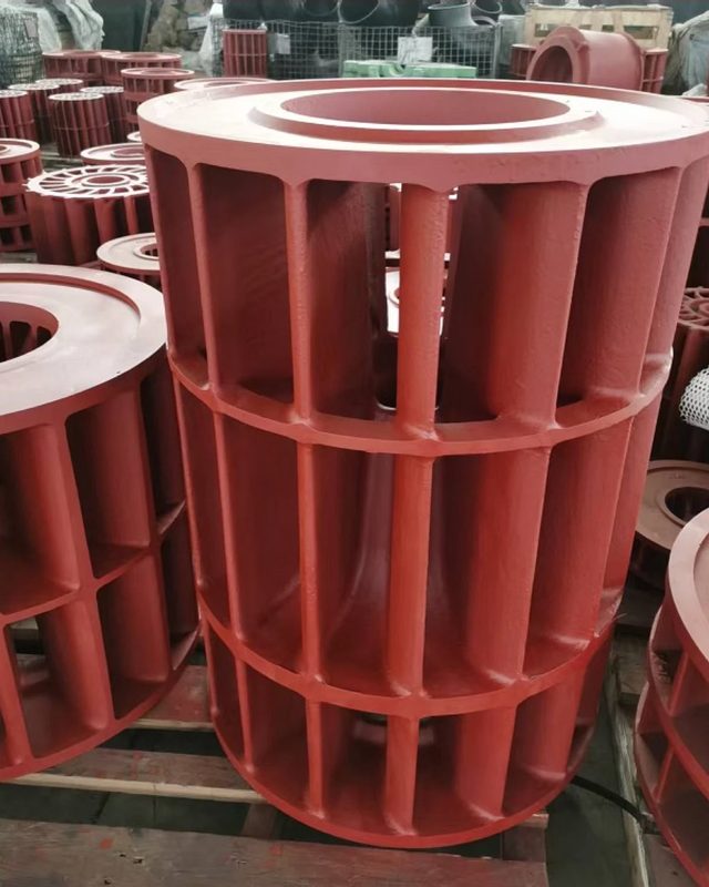 Heavily ribbed cylindrical iron casting in red primer